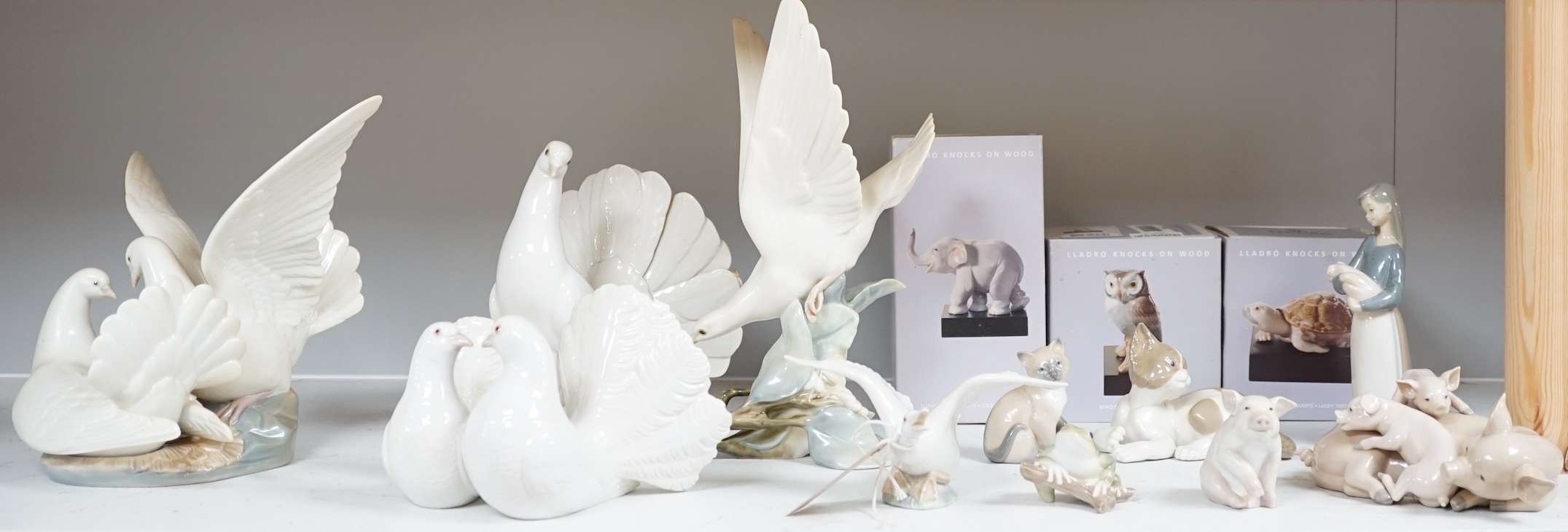 Fourteen Lladro models to include nine various animals and five birds (all boxed), largest 29cm high. Condition - good